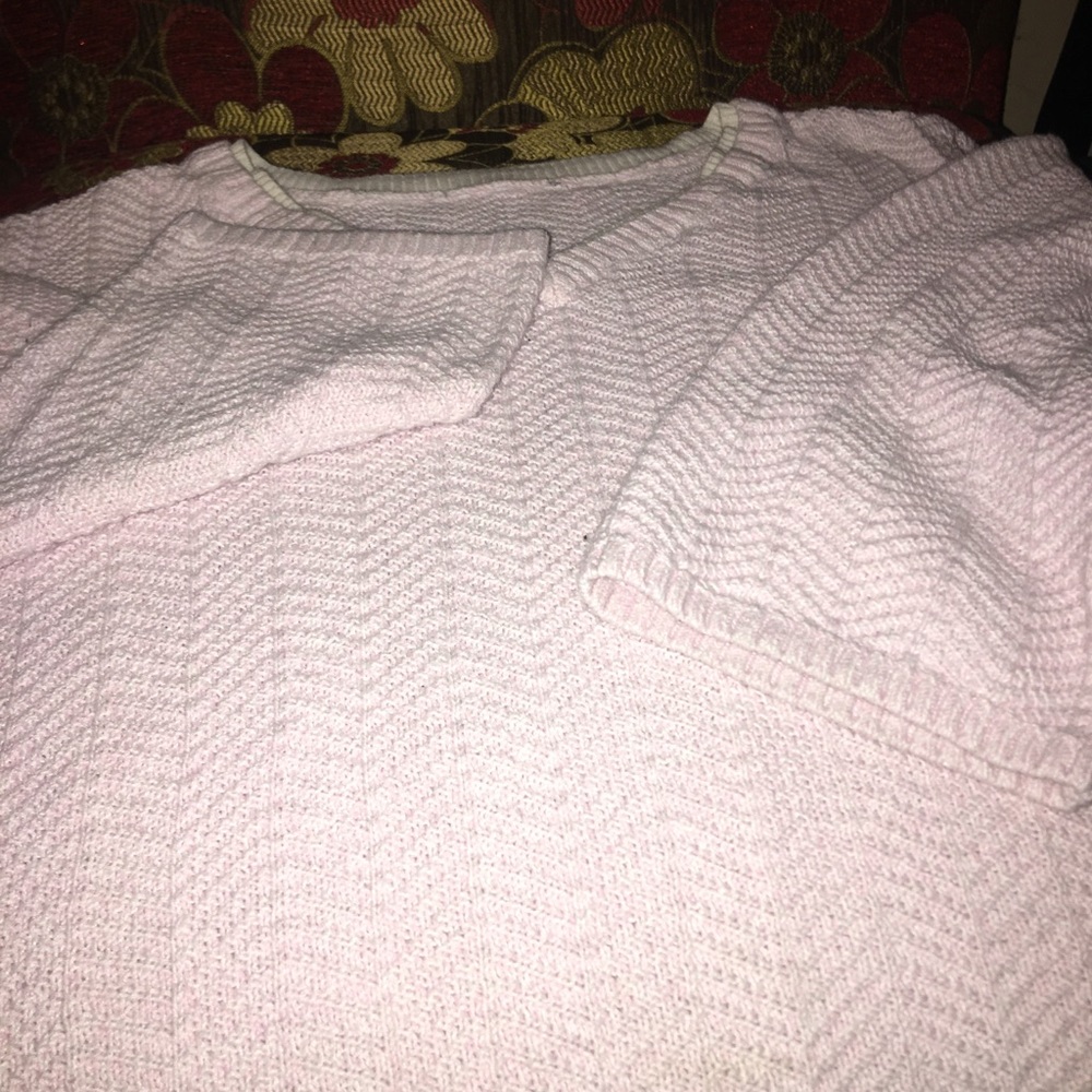 Pink and whit sweater.